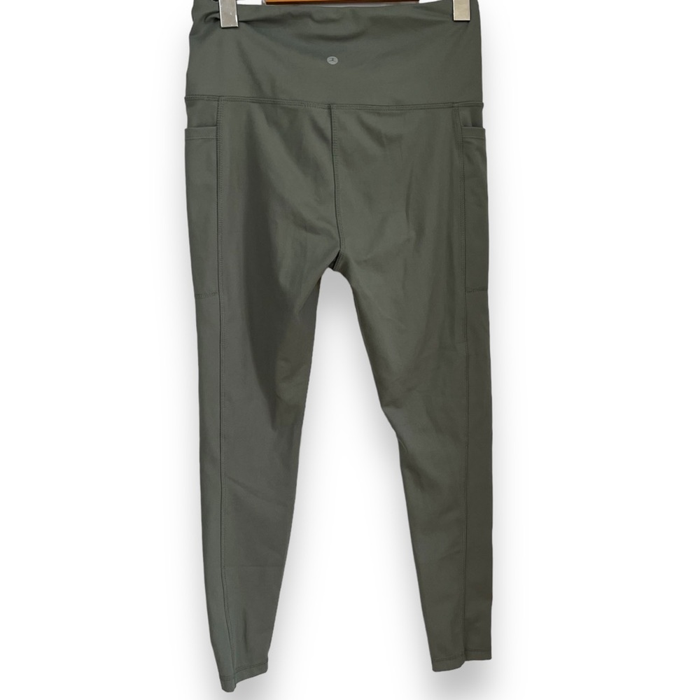 Danskin green leggings high rise with pockets on each leg size medium